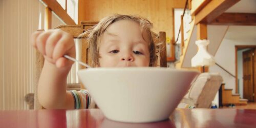 A child having a bowl of cereal