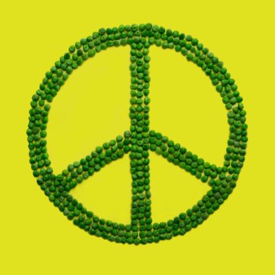 Peace sign shaped with peas