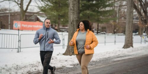 Coach encouraging woman to run