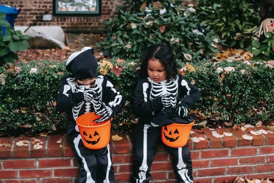 Children in Halloween Costumes with sweets