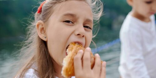 Girl eating a Croissant