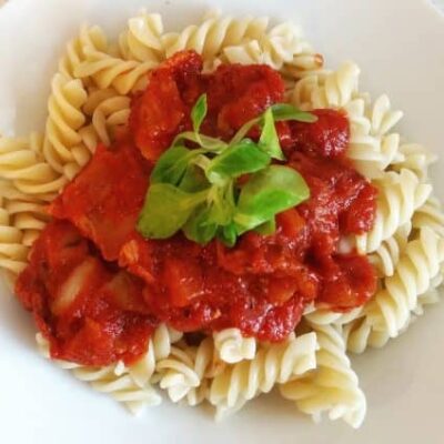A picture of homemade pasta and tomato sauce