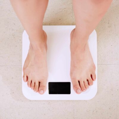 Person standing on an electronic weighing scale