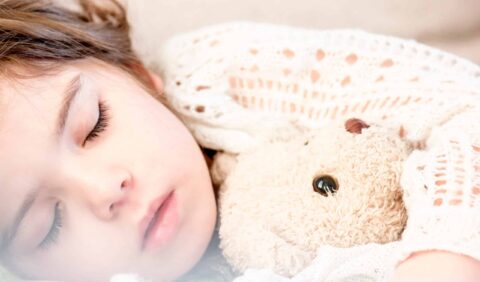 Girl Sleeping With Her Brown Plush Toy