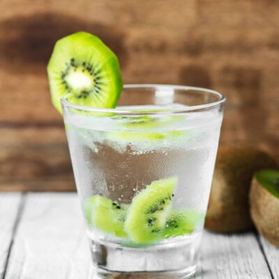 A cold drink flavoured with kiwi