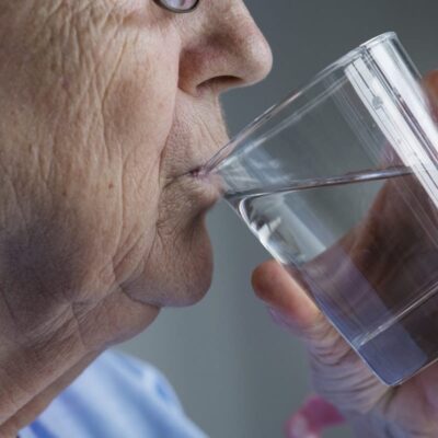 Older person drinking water
