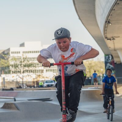 Young boy doing stunts on a scooter
