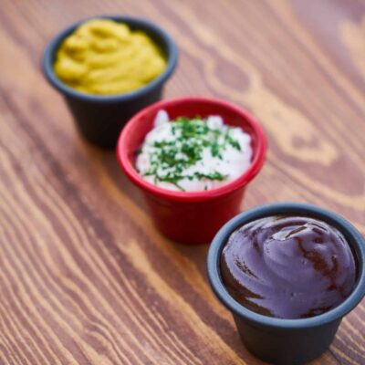 Three dips in 3 containers including barbecue, mustard and ranch