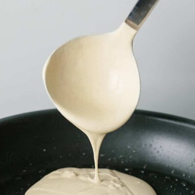 Pouring pancake batter on a hot pan