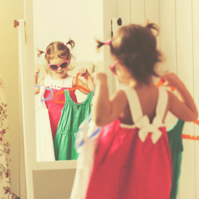Girl dressing up with a mirror