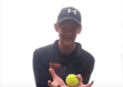 Alex catching a tennis ball