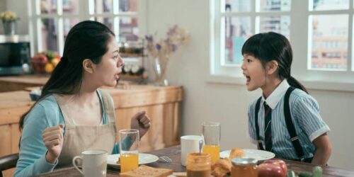 angry mom and kid argue in breakfast time