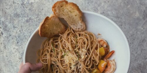 A plate of noodles and bread
