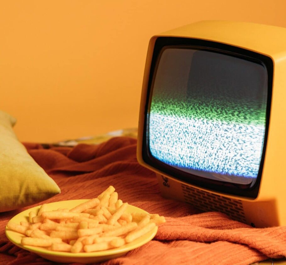 Junk food in front of a television screen