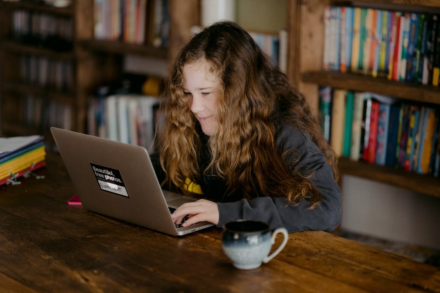 Teenage girl learning online