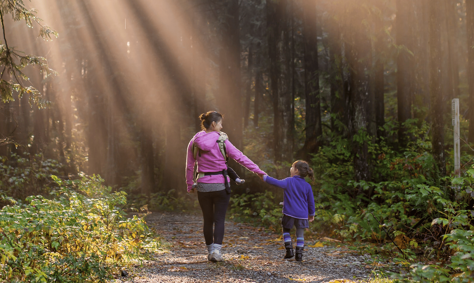 Mother and daughter walking in the sun